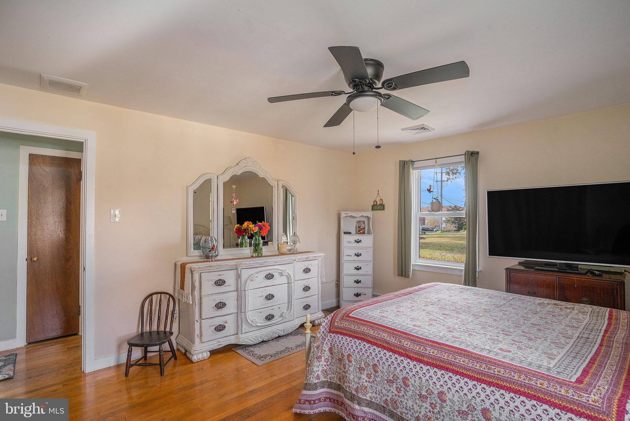 501 Walnut Street Green Lane, PA 18054 - Photo 12 of 28 a bedroom with a bed and a flat screen tv