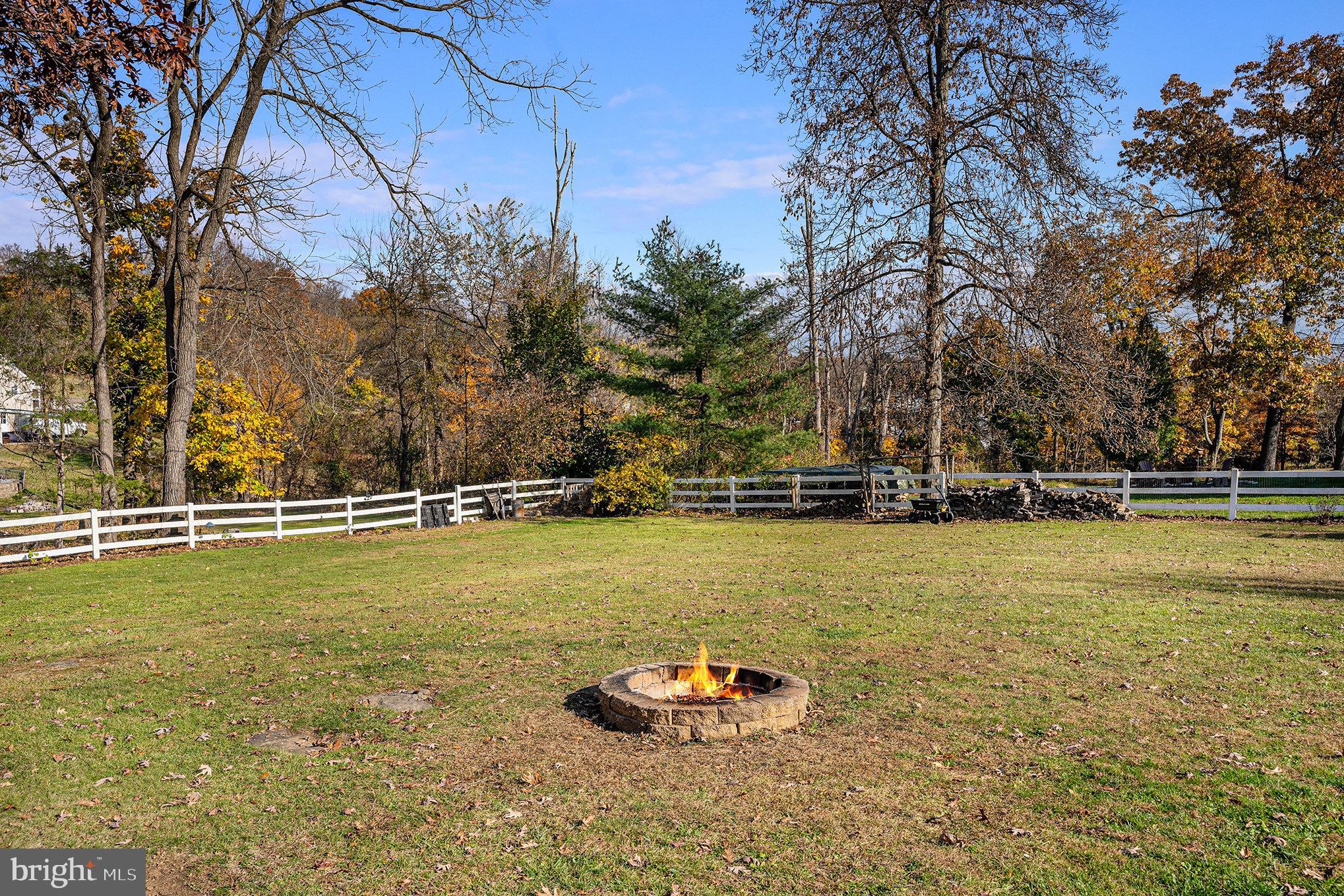 501 Walnut Street Green Lane, PA 18054 - Photo 22 of 28 a view of a swimming pool with an outdoor space and seating area