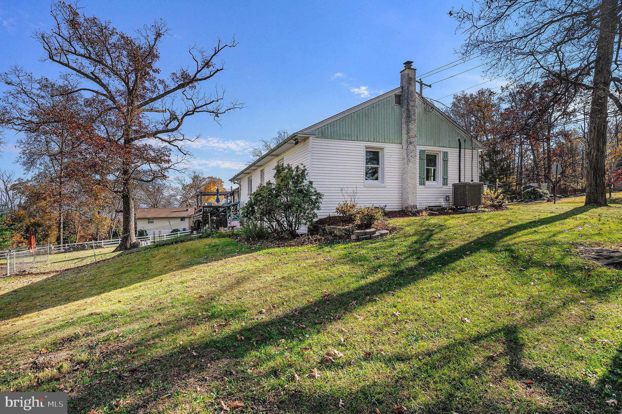 501 Walnut Street Green Lane, PA 18054 - Photo 26 of 28 a front view of house with yard and trees