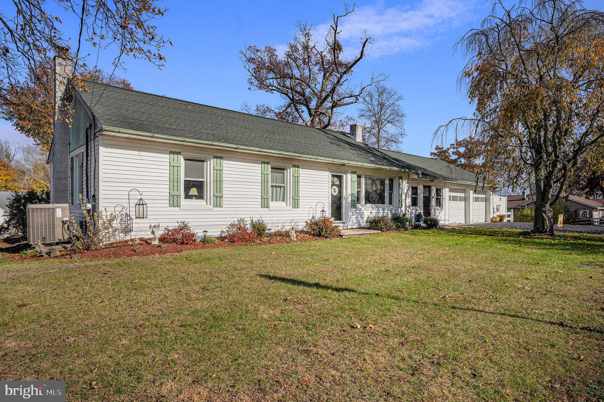 501 Walnut Street Green Lane, PA 18054 - Photo 27 of 28 a view of a house with a big yard and palm trees