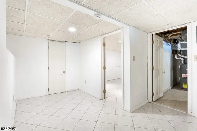 a view of a house with backyard and a tree