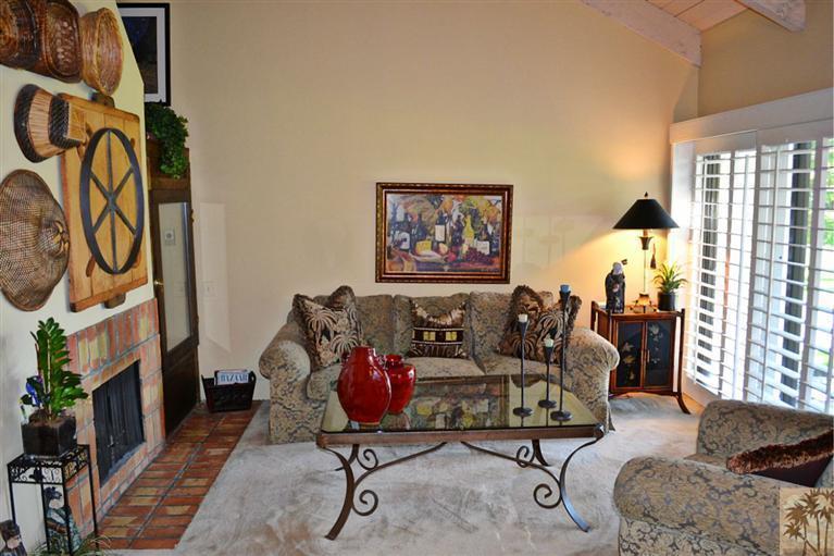 110 South Racquet Club Drive Rancho Mirage, CA 92270 - Photo 3 of 17 a living room with furniture and a window