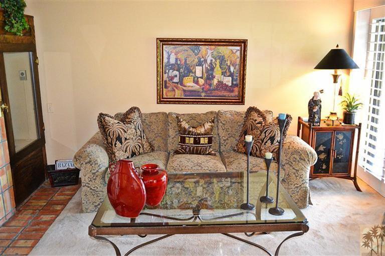 110 South Racquet Club Drive Rancho Mirage, CA 92270 - Photo 6 of 17 a living room with furniture and lamp