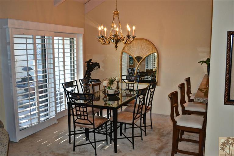 110 South Racquet Club Drive Rancho Mirage, CA 92270 - Photo 10 of 17 a view of a dining room with furniture and chandelier