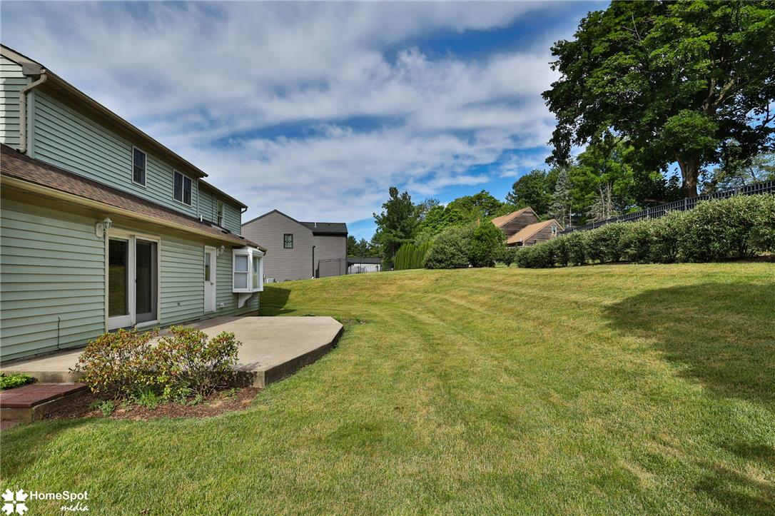 4059 Wedgewood Road Allentown, PA 18104 - Photo 66 of 72 A spacious backyard with mature trees and a generously sized patio offers ample outdoor living.