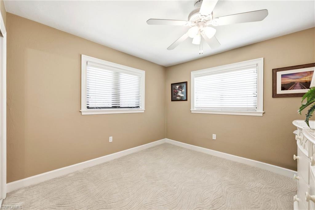 5201 31st Place Southwest Naples, FL 34116 - Photo 13 of 24 a view of an empty room with a window