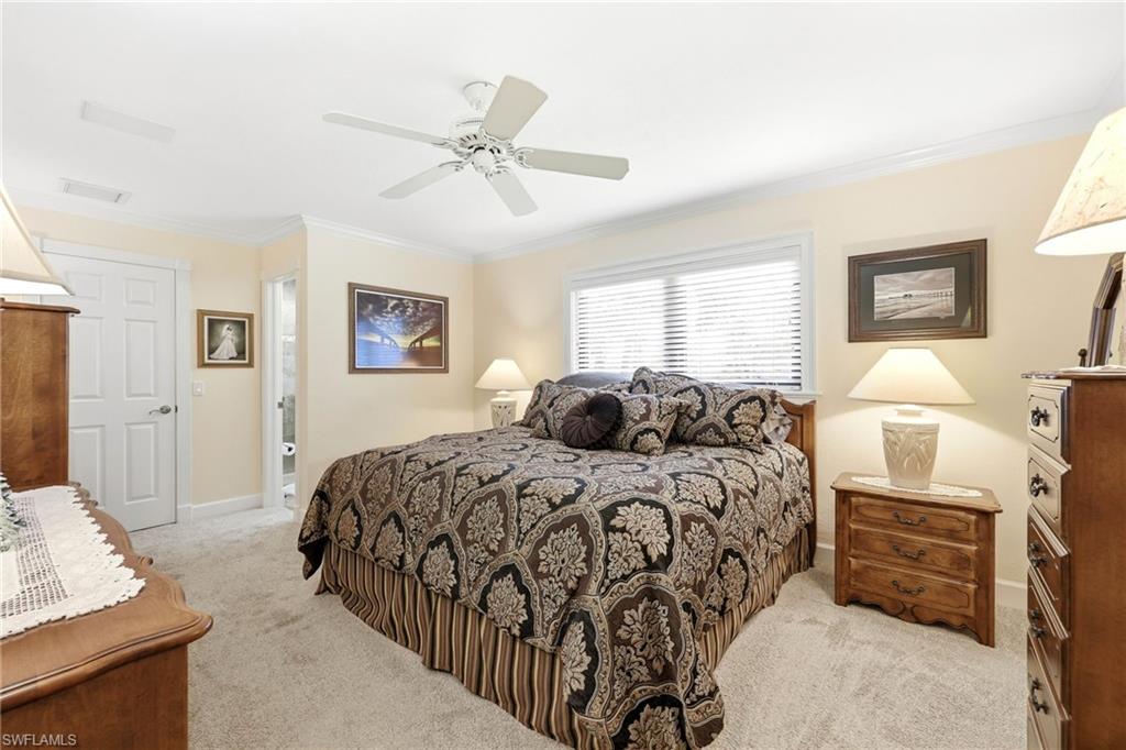 5201 31st Place Southwest Naples, FL 34116 - Photo 19 of 24 a bed room with a bed and a window