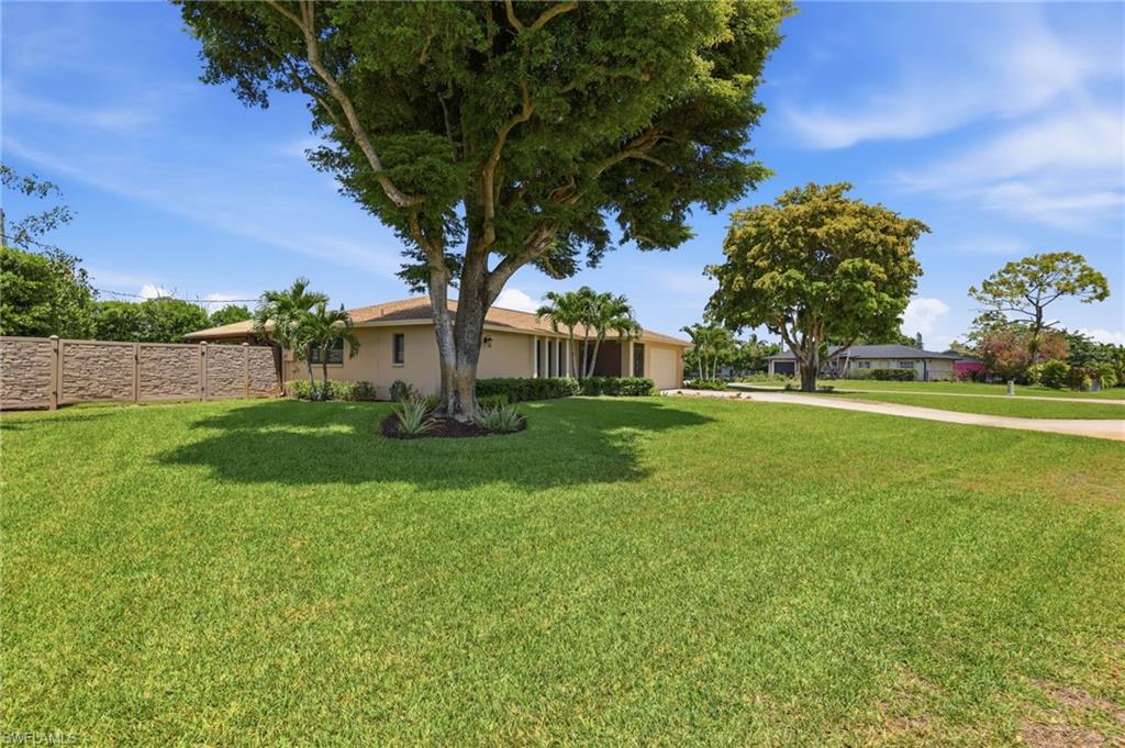 5201 31st Place Southwest Naples, FL 34116 - Photo 23 of 24 a view of a park with large trees
