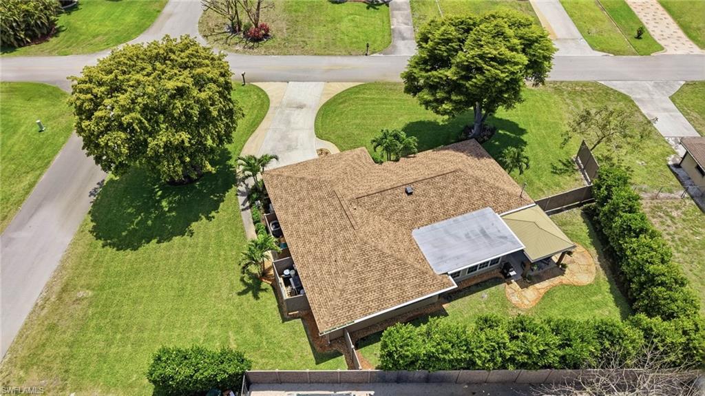 5201 31st Place Southwest Naples, FL 34116 - Photo 24 of 24 an aerial view of a house with a yard and garden
