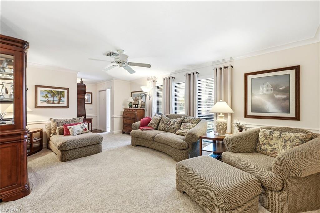 5201 31st Place Southwest Naples, FL 34116 - Photo 5 of 24 a living room with furniture and a large window