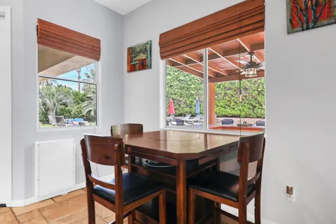 a dining room with furniture and window