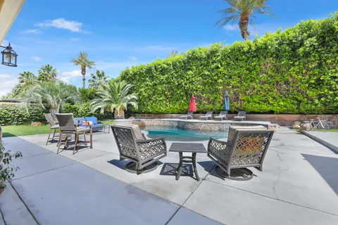 a view of a swimming pool with a patio