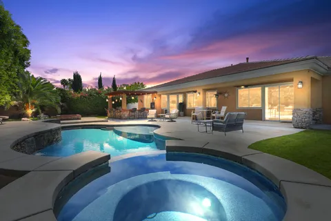 a view of a swimming pool with a patio