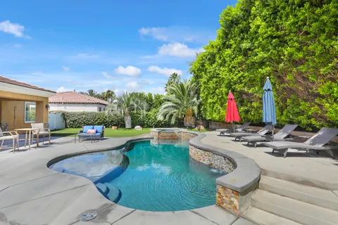 a view of a swimming pool with a patio