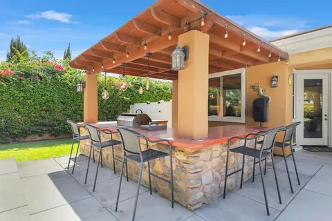 a outdoor space with a table and chairs