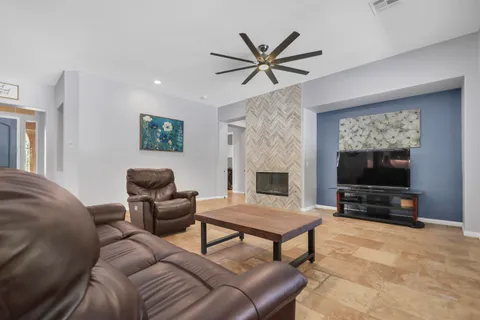 a living room with furniture and a window