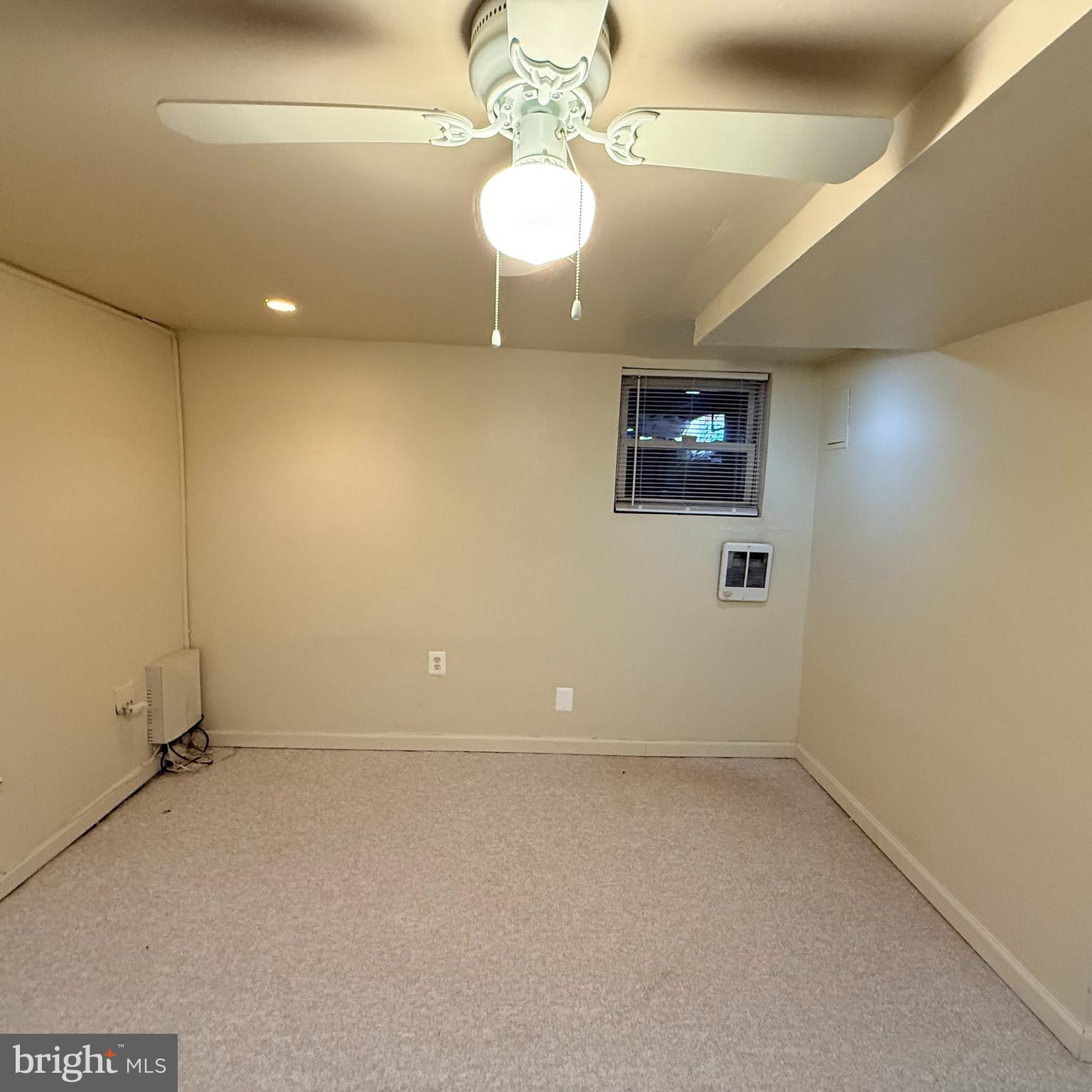 33 Randolph Place Northwest, Unit B Washington, DC 20001 - Photo 17 of 23 an empty room with a chandelier fan and wooden floor