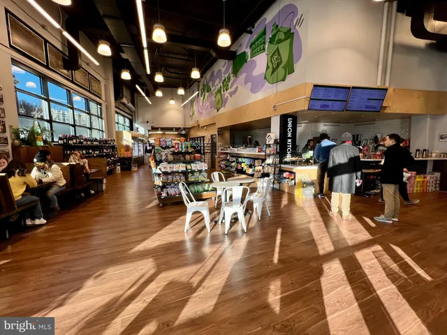 a group of people sitting on the floor of a building