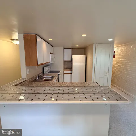 a view of kitchen island sink