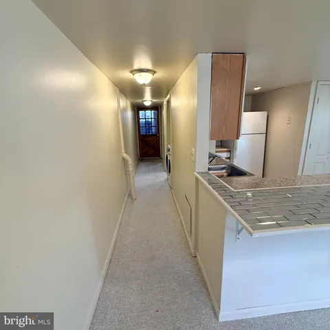 a hallway with a sink