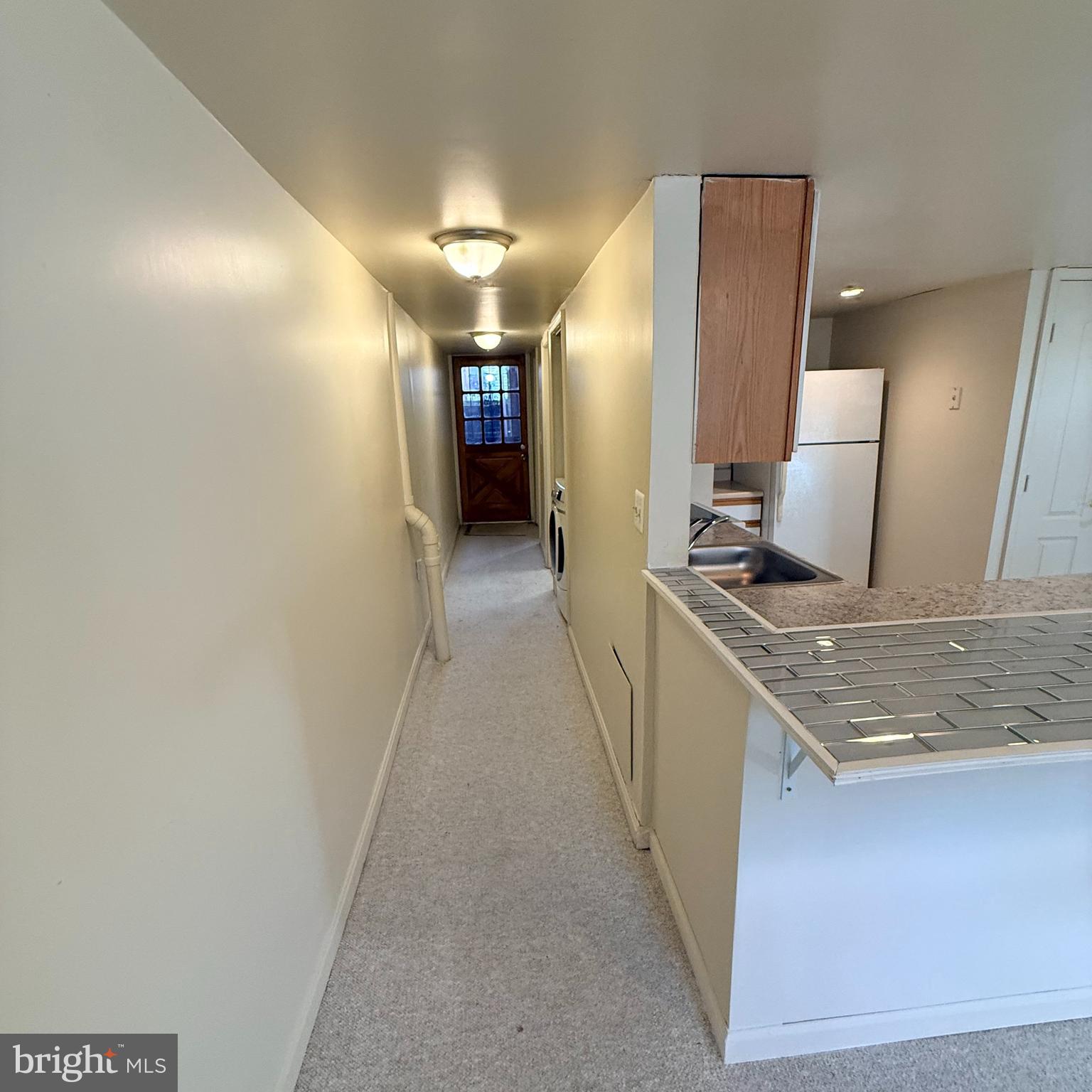 33 Randolph Place Northwest, Unit B Washington, DC 20001 - Photo 5 of 23 a hallway with a sink