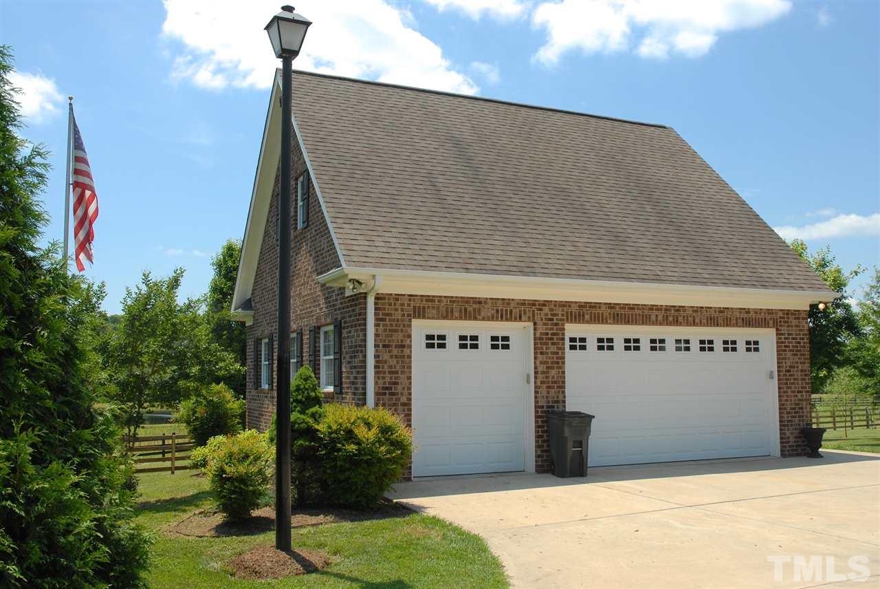 5390 Helena Moriah Road Rougemont, NC 27572 - Photo 3 of 25 Detached three car garage with wired workshop and permanent stairs to second level.