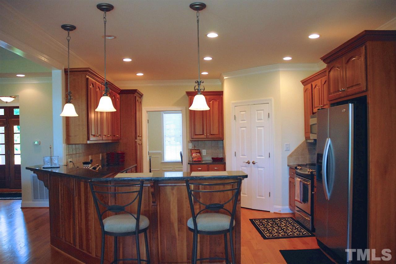 5390 Helena Moriah Road Rougemont, NC 27572 - Photo 7 of 25 Kitchen with high-end cabinets, tremendous storage, granite tops, ss appliances.