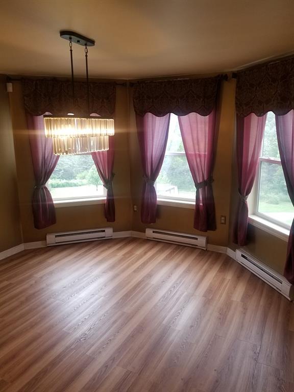 422 Stable Road Indiana, PA 15701 - Photo 6 of 32 an empty room with wooden floor and windows