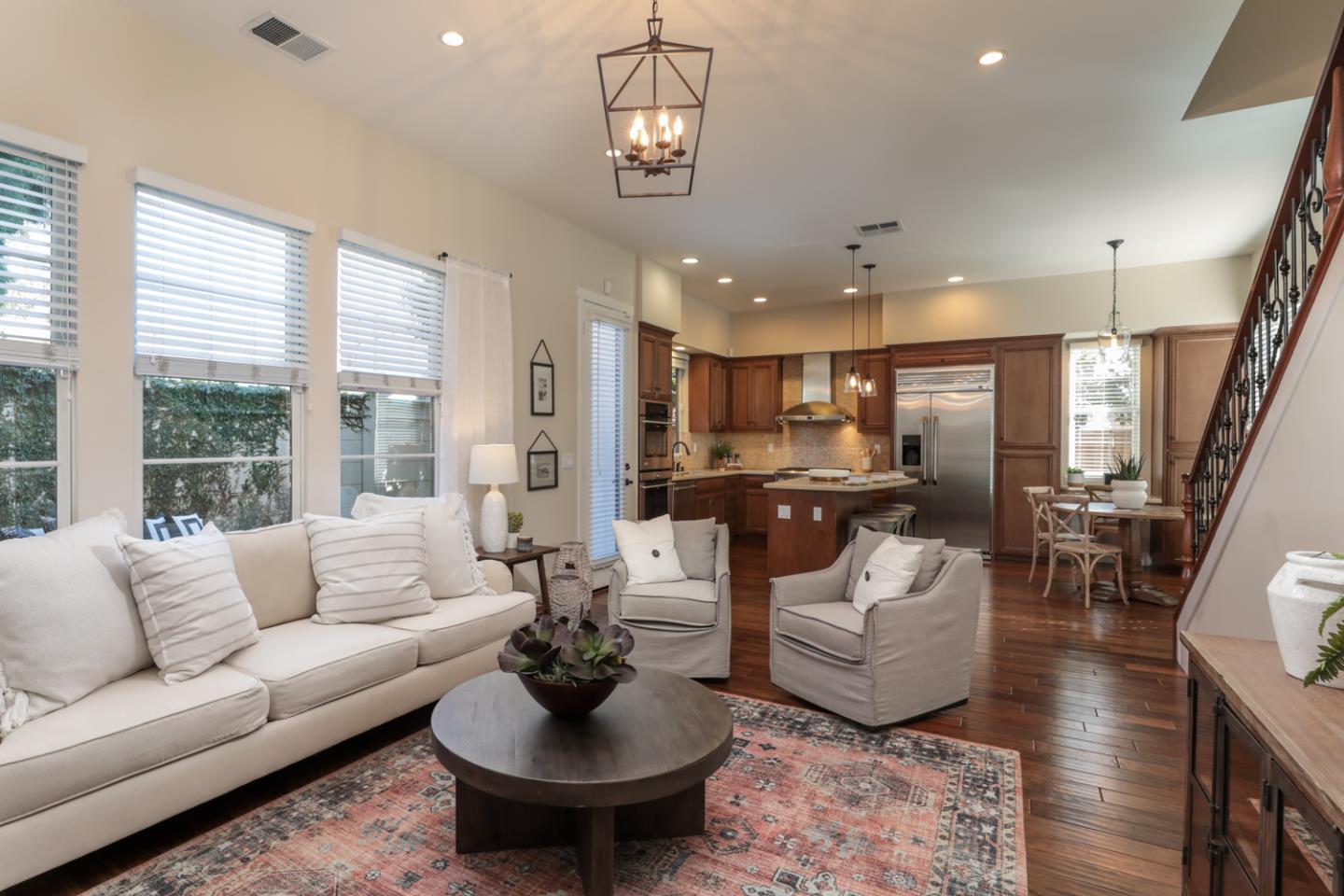 920 Rincon Street Mountain View, CA 94040 - Photo 12 of 45 a living room with furniture kitchen view and a large window