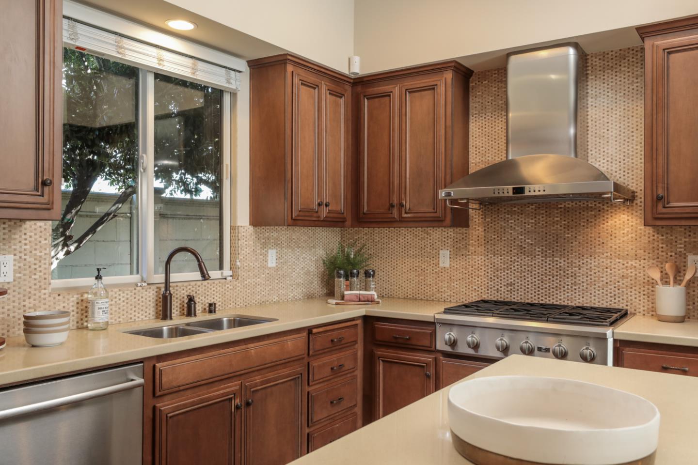 920 Rincon Street Mountain View, CA 94040 - Photo 15 of 45 a kitchen with a sink stove and cabinets