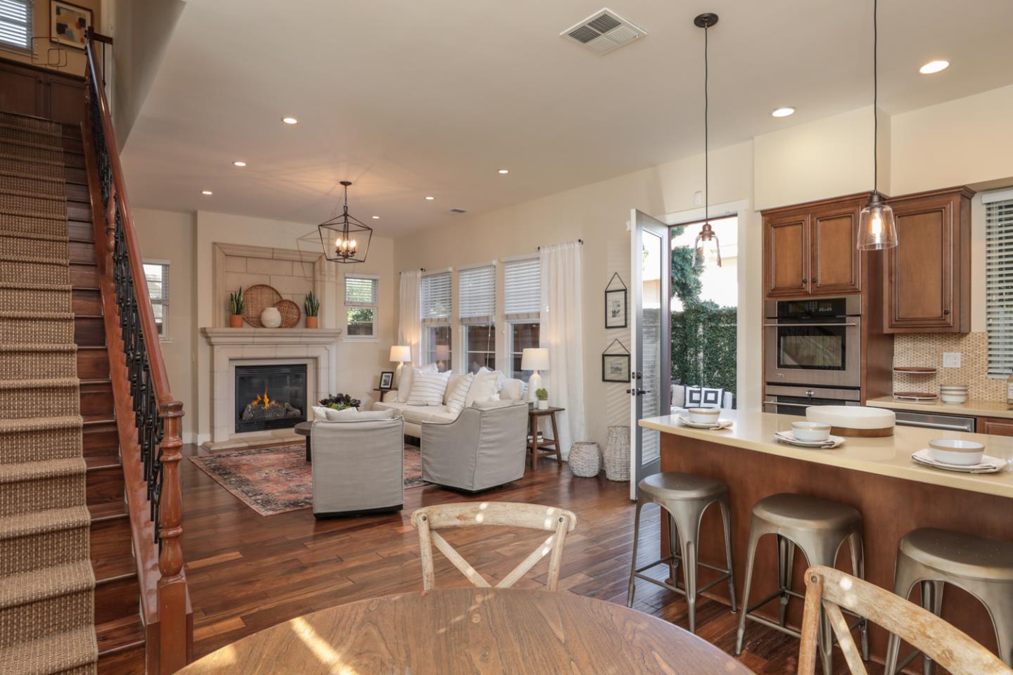 920 Rincon Street Mountain View, CA 94040 - Photo 18 of 45 a living room with fireplace furniture and a fireplace