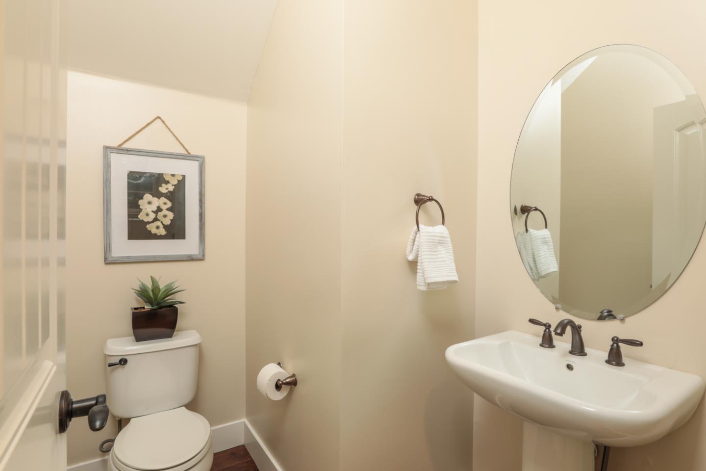 920 Rincon Street Mountain View, CA 94040 - Photo 19 of 45 a bathroom with a toilet sink and mirror