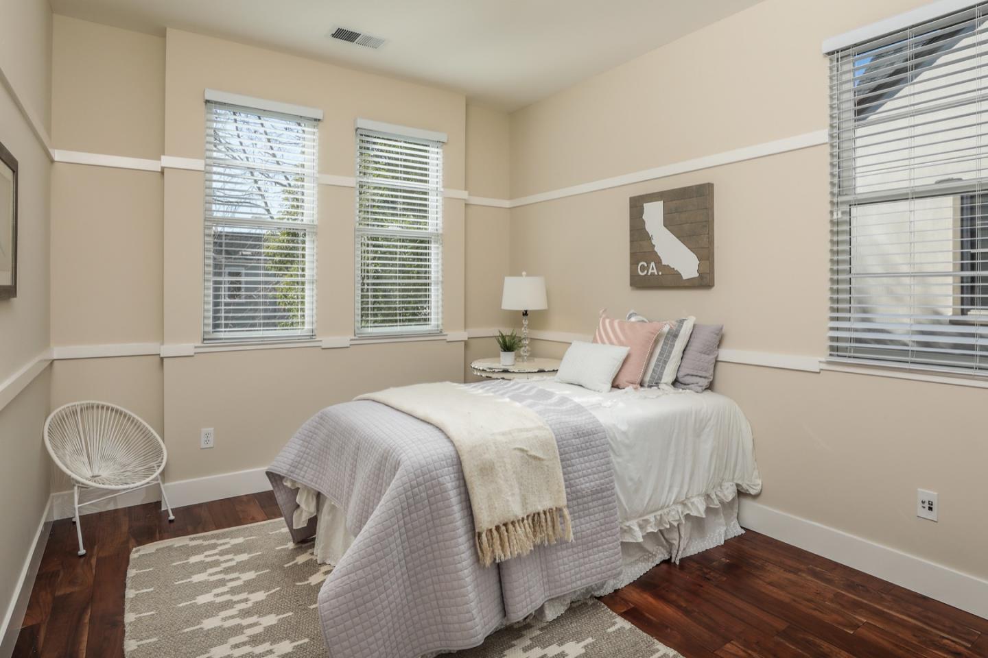 920 Rincon Street Mountain View, CA 94040 - Photo 30 of 45 a bedroom with a bed and wooden floor