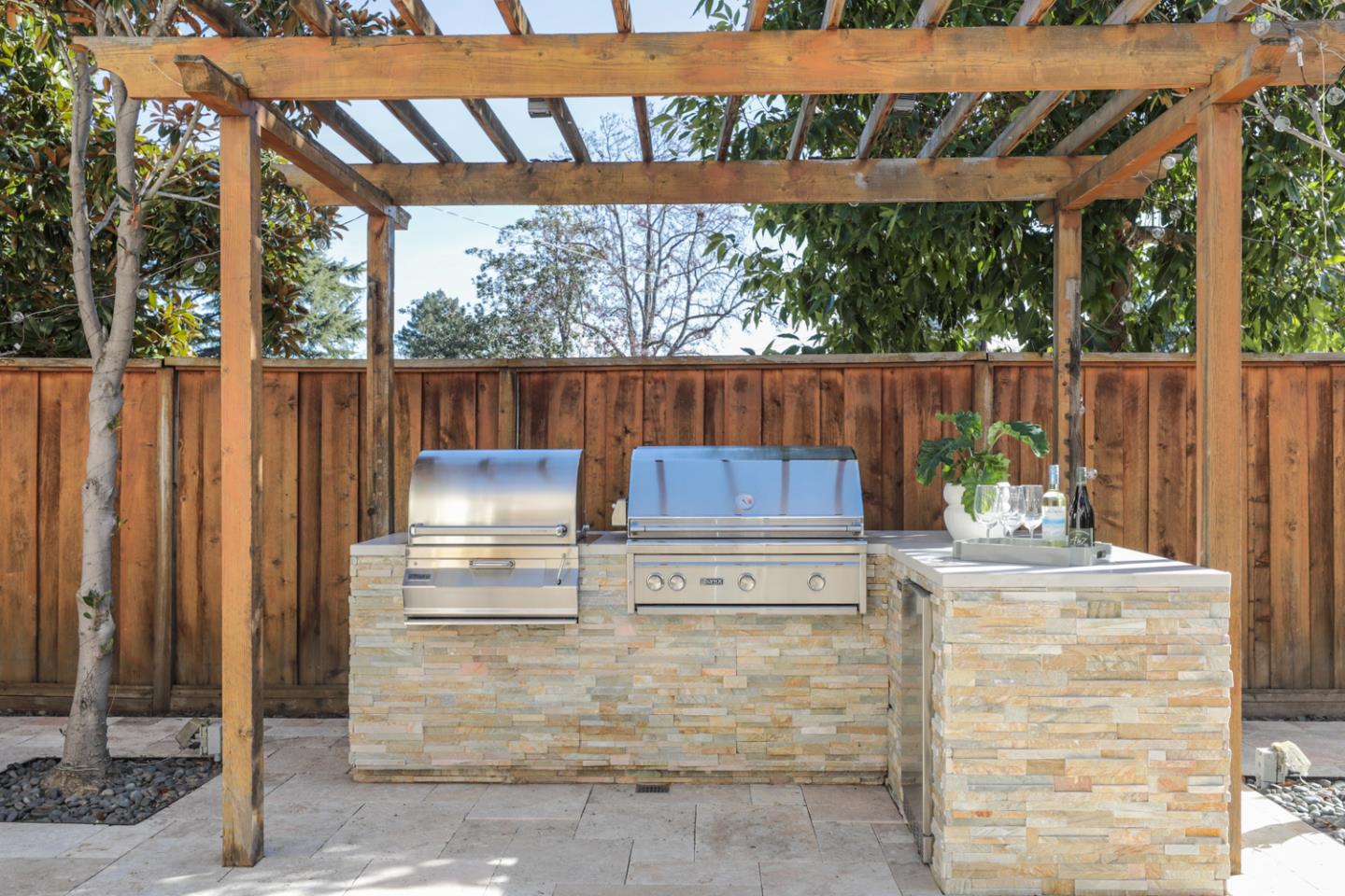 920 Rincon Street Mountain View, CA 94040 - Photo 35 of 45 a view of backyard with table and chairs and wooden fence