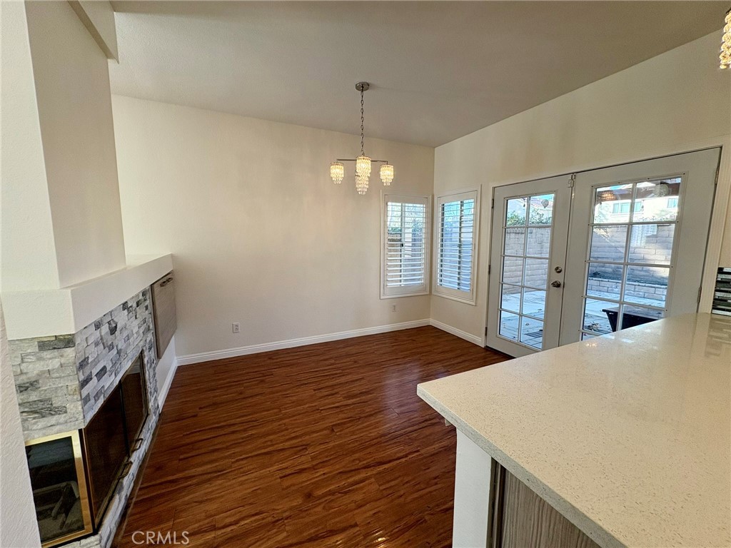 7280 Comiso Way Rancho Cucamonga, CA 91701 - Photo 14 of 66 a view of a hallway with wooden floor and staircase