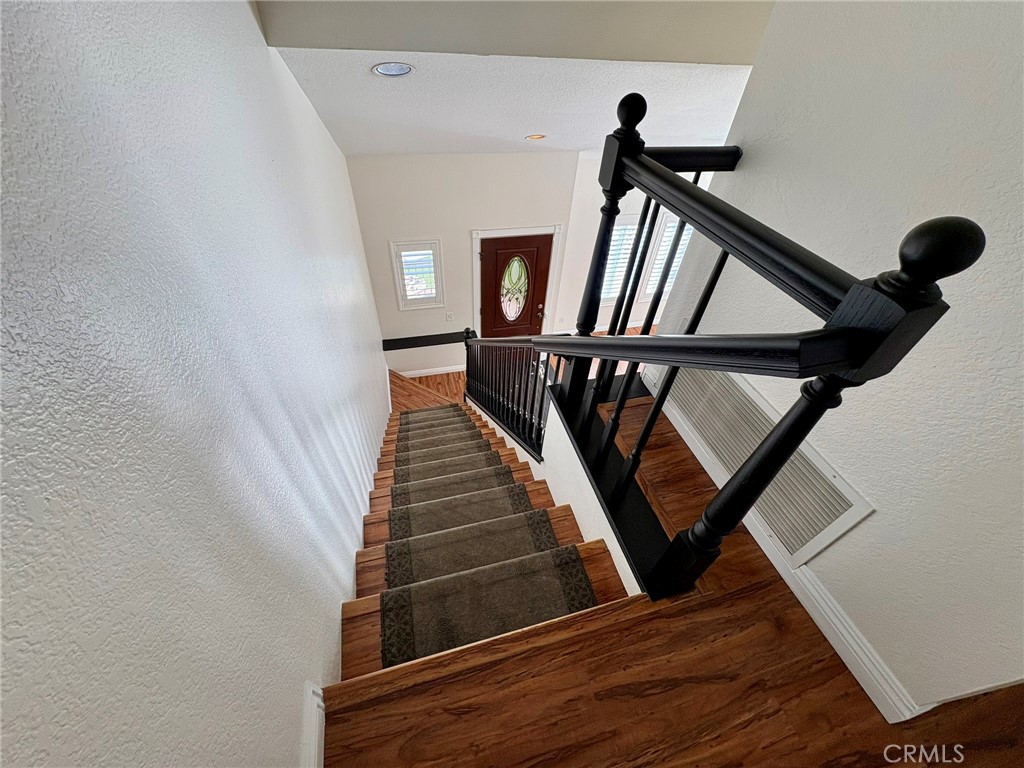 7280 Comiso Way Rancho Cucamonga, CA 91701 - Photo 34 of 66 a view of entryway and hall with wooden floor