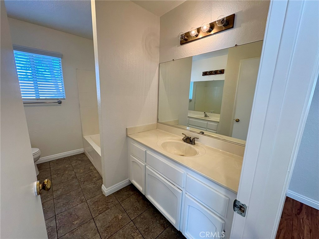 7280 Comiso Way Rancho Cucamonga, CA 91701 - Photo 50 of 66 a bathroom with a sink and a mirror