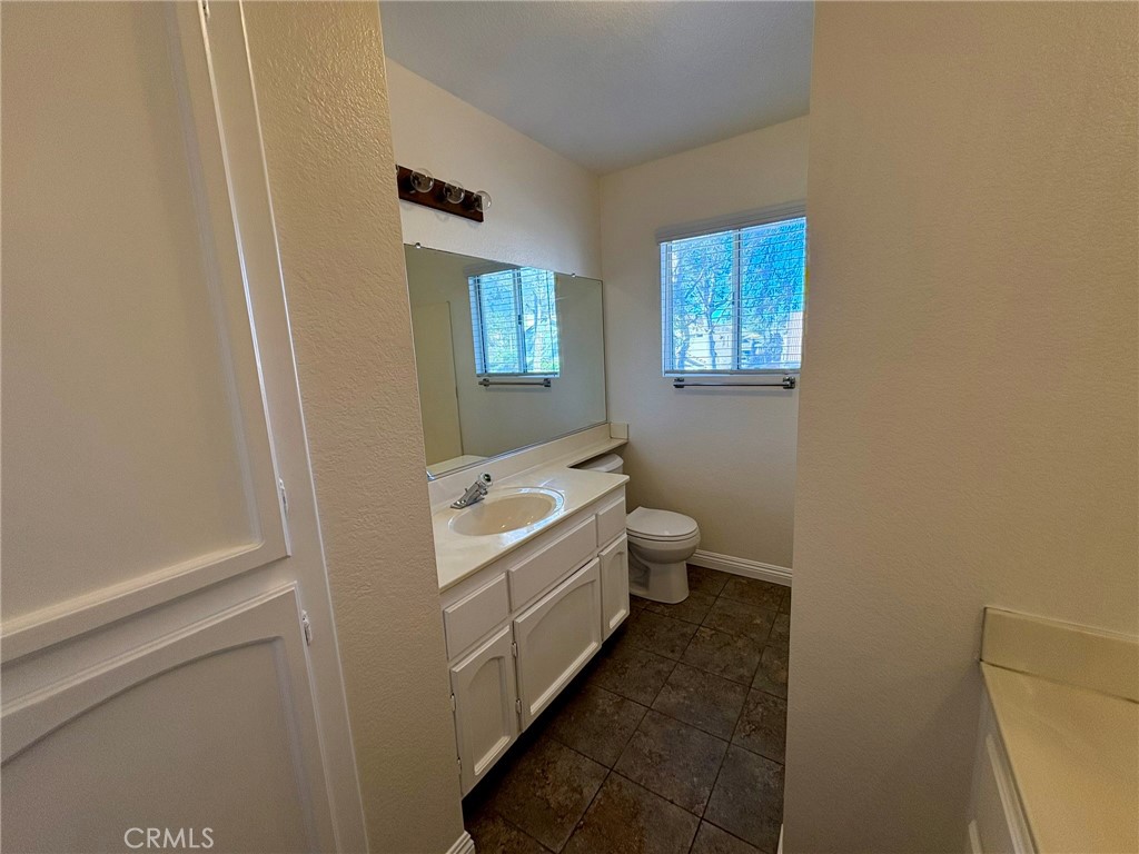 7280 Comiso Way Rancho Cucamonga, CA 91701 - Photo 51 of 66 a bathroom with a sink and a mirror