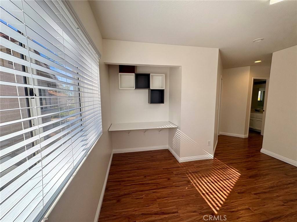 7280 Comiso Way Rancho Cucamonga, CA 91701 - Photo 60 of 66 a view of a room with wooden floor and staircase