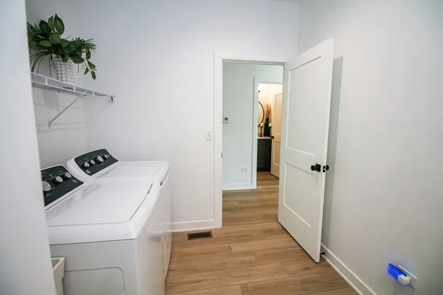 a view of storage and utility room with washer and dryer