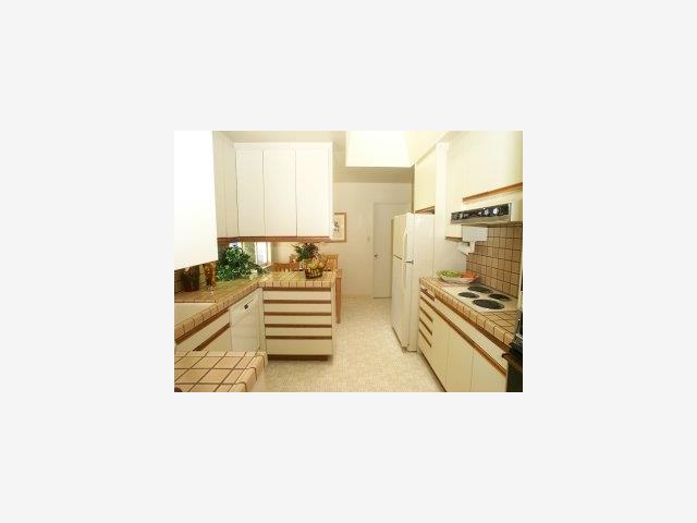 19907 Bonnie Ridge Way Saratoga, CA 95070 - Photo 5 of 6 a upper view of a kitchen with a sink and a refrigerator