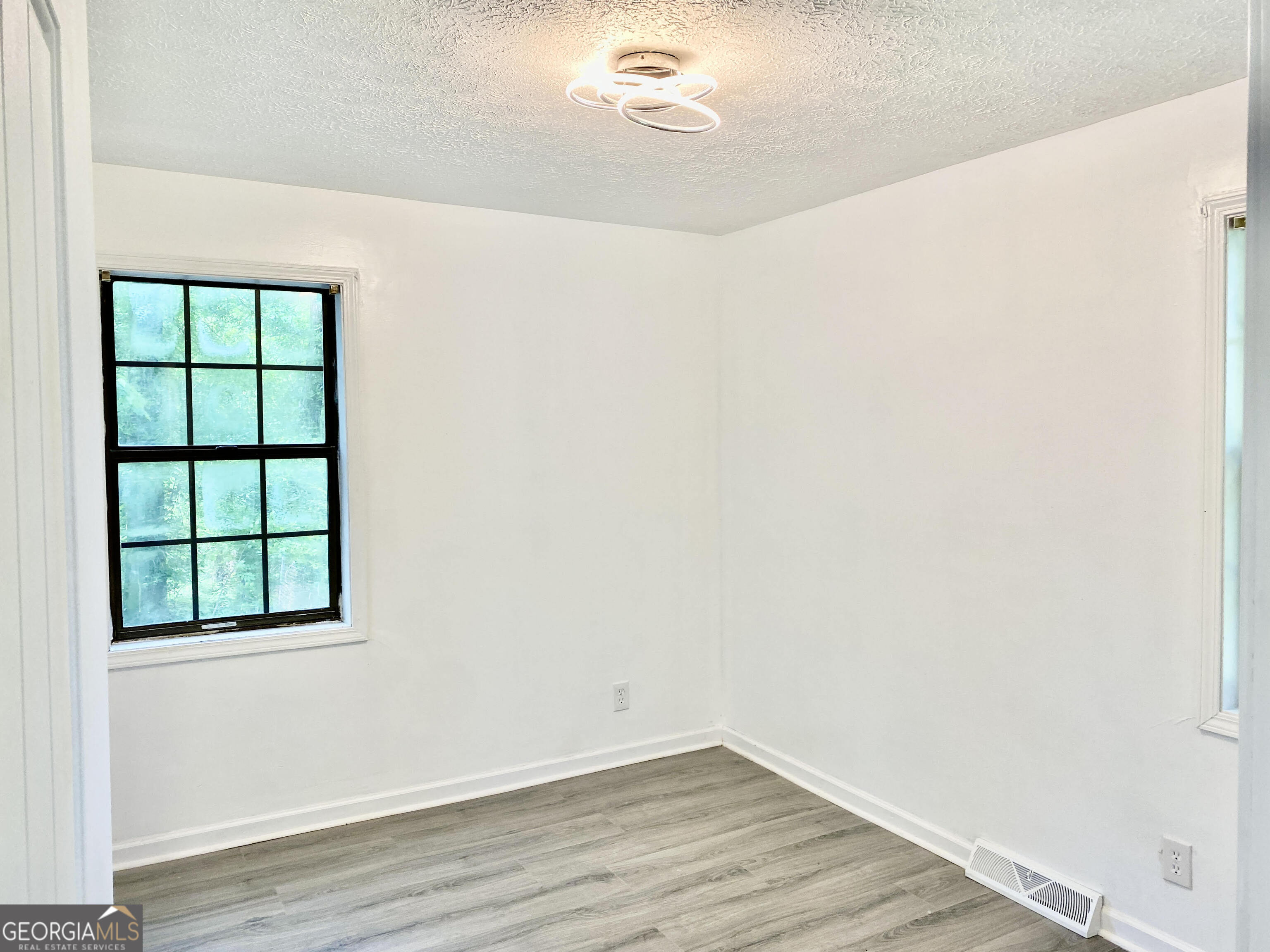5 Red Fox Drive Southwest Rome, GA 30165 - Photo 11 of 22 a view of a small space with wooden floor and a window