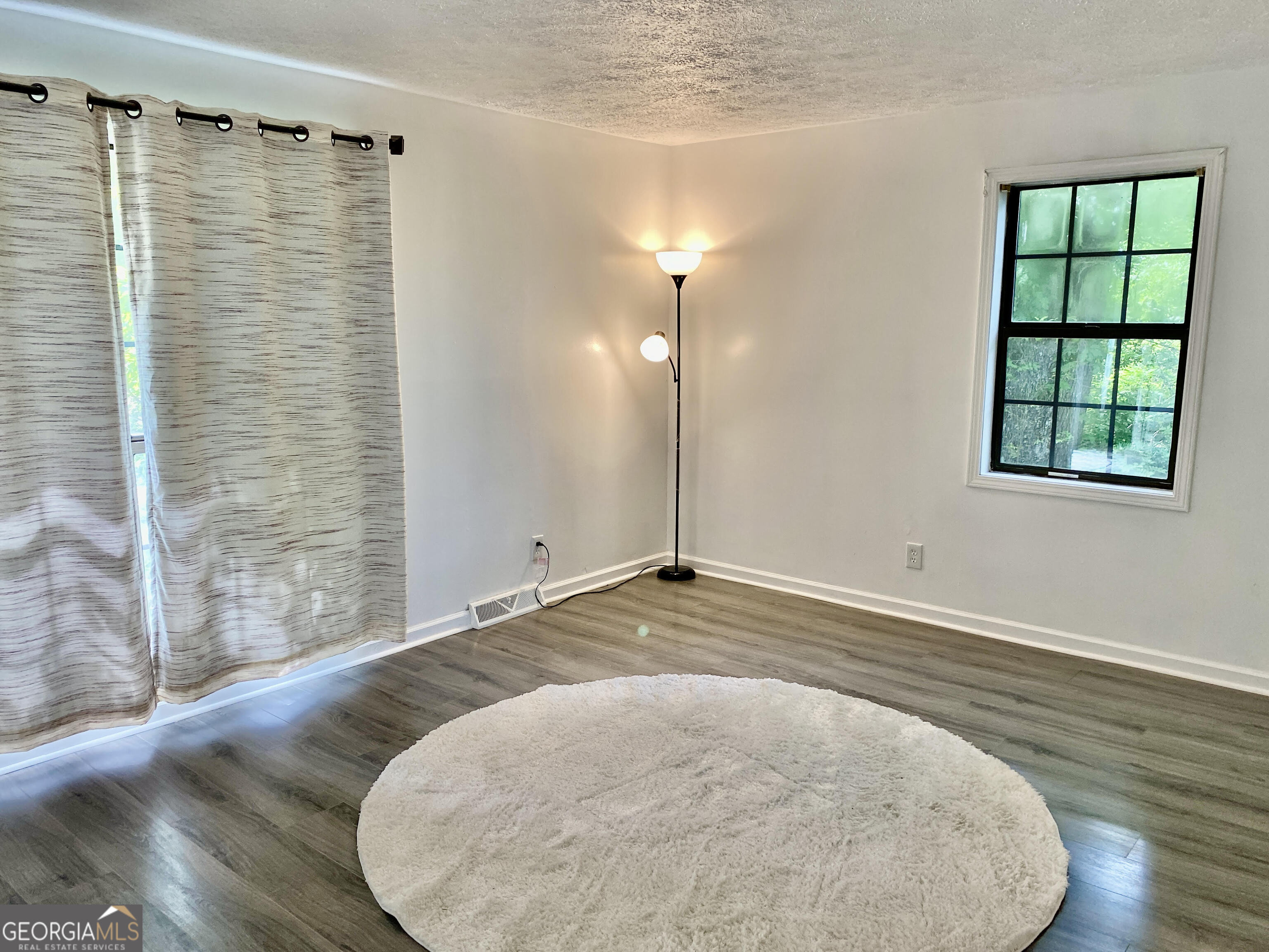 5 Red Fox Drive Southwest Rome, GA 30165 - Photo 12 of 22 a view of a livingroom with wooden floor and a window