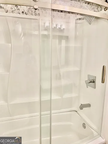 a close up of a bathtub curtain