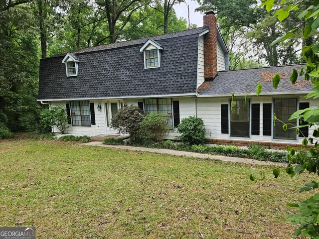 a house that has a lot of plants in it