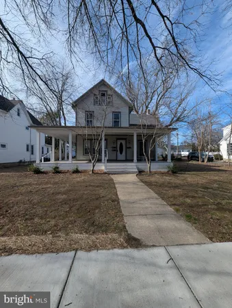 a view of large house with a yard