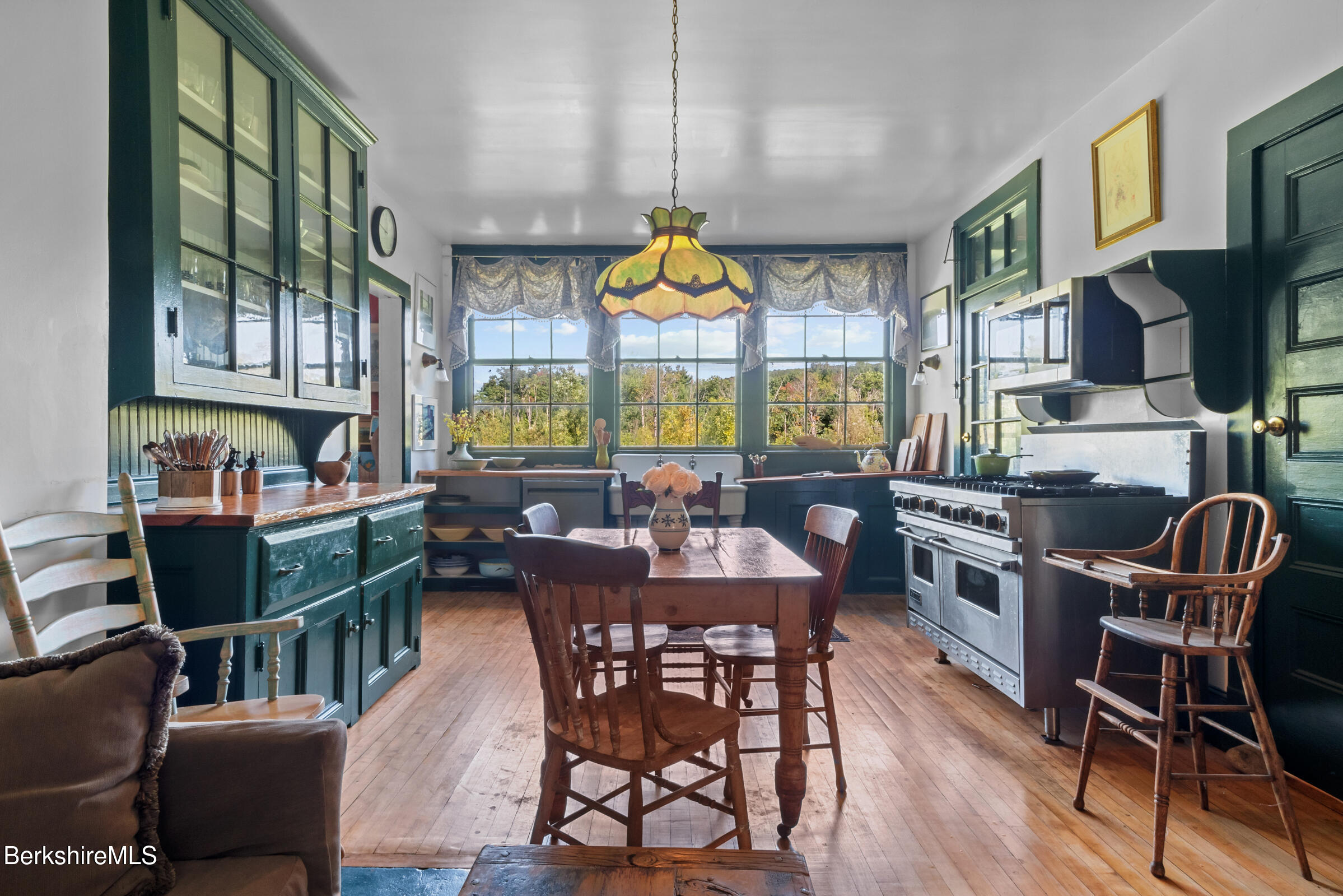 535 Main Road Monterey, MA 01245 - Photo 22 of 45 a dining room with furniture a rug and wooden floor