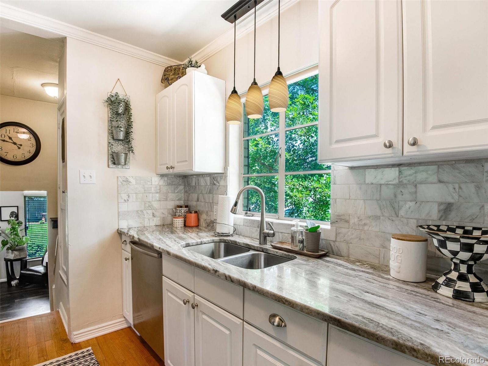 520 East 5th Avenue Denver, CO 80203 - Photo 12 of 40 a kitchen with sink and window