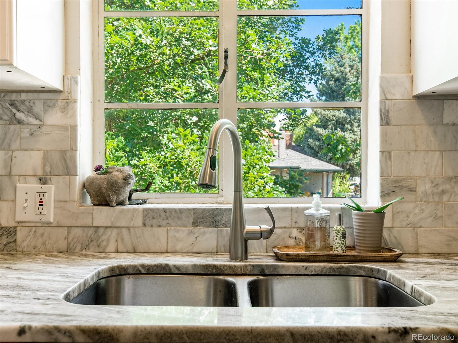 520 East 5th Avenue Denver, CO 80203 - Photo 15 of 40 a close view of a sink and window