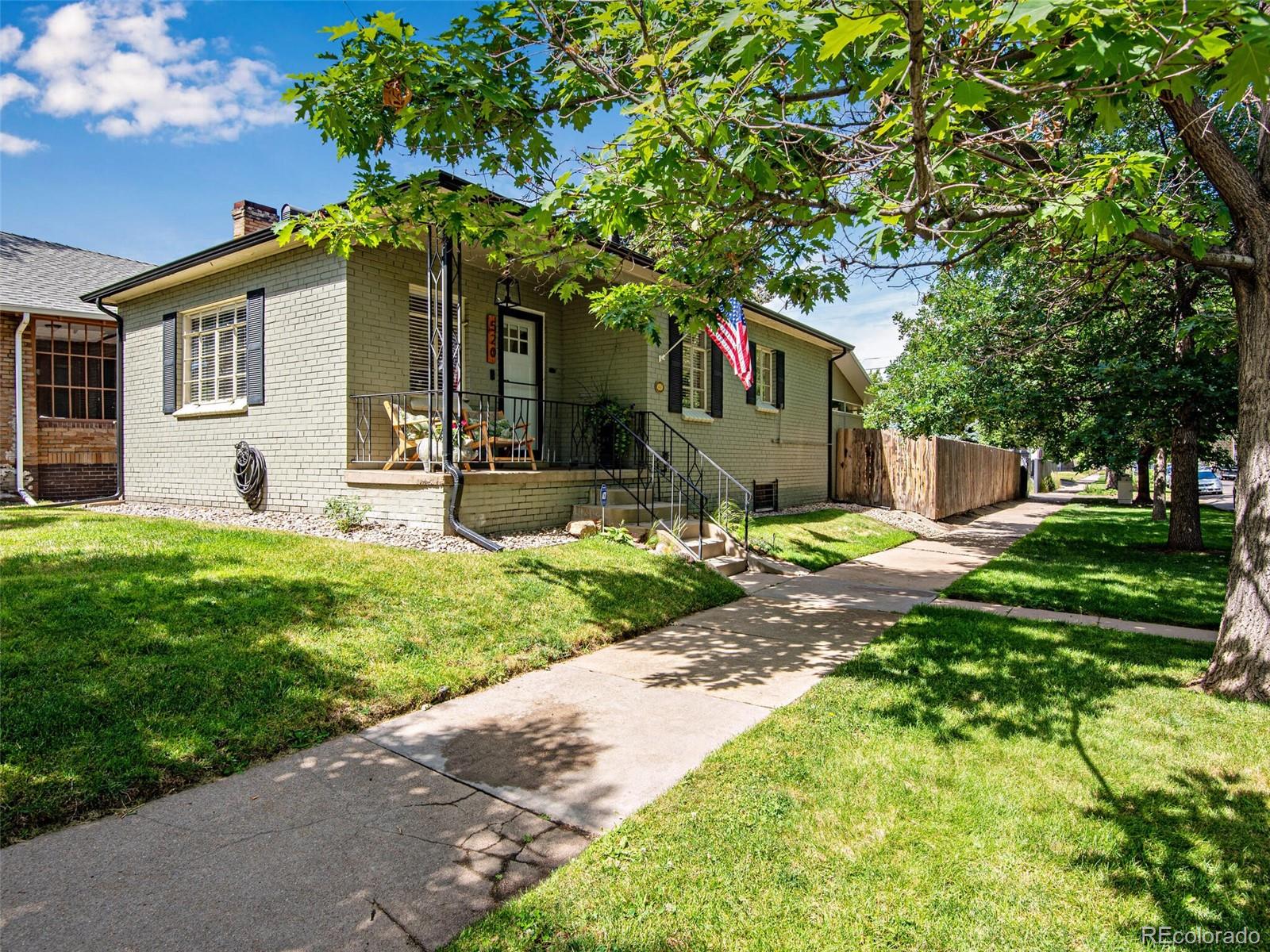 520 East 5th Avenue Denver, CO 80203 - Photo 2 of 40 a front view of a house with garden